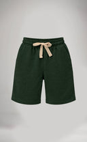 Green shorts with a beige drawstring on a light gray background